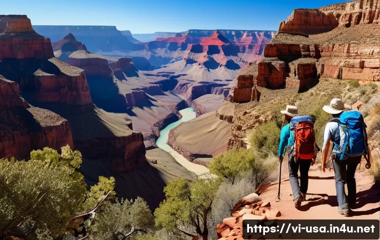 미국 그랜드캐년 여행 - A scenic hiking trail winding through the vibrant red rock cliffs of the Grand Canyon under clear bl...